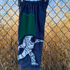 Upcycled from high count cotton sheets, green cotton ribbed curtains, and a cotton graphic t-shirt. Wide leg, super comfortable and flow vibes, with revealed yellow and orange stitching for colorful vibes. Worn as capris length pants for taller ones, otherwise as long pants. Two deep pockets for all the treasures and magical things.  Handcrafted with love and intention.  Handmade in Santa Cruz, CA One-of-a-kind Size 6-8T - capris shorts, slender fit