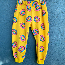 Load image into Gallery viewer, Upcycled from a retro graphic cotton hoodie! Cuffed bottoms, super yummy, and textile is durable and ready for the playground! All the kids will be lining up for some DONUTS!   Handcrafted with love and intention.  Handmade in Santa Cruz, CA One-of-a-kind Retro vibes Size 18-24 mo Cuff bottoms
