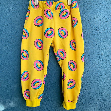 Upcycled from a retro graphic cotton hoodie! Cuffed bottoms, super yummy, and textile is durable and ready for the playground! All the kids will be lining up for some DONUTS!   Handcrafted with love and intention.  Handmade in Santa Cruz, CA One-of-a-kind Retro vibes Size 18-24 mo Cuff bottoms