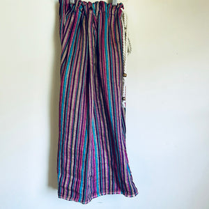 Upcycled from vintage remnant, and salvaged cord and beads, this piece is wide legged and flowy, and versatile in size with adjustable cord. Striped with lively colors, capris length vibes. Perfect for summertime fun!&nbsp;&nbsp;  Handcrafted with love and intention.&nbsp;  Handmade in Santa Cruz, CA One-of-a-kind Size 6-10 youth (fits longer for smaller sizes, capris length for bigger babes!) Cold wash, hang dry