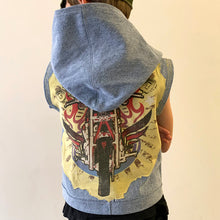 Load image into Gallery viewer, Upcycled from a well loved cotton t-shirt, and a pair of COTTON:ON adult jeans - denim pants that are made with 20% recycled cotton and washed using reduced water techniques. Using existing textiles, to create a new, super funky fly spirit vest that is represents conscious clothing and wearable art. Oversized hoodie, button clasp, and lots of whimsical detail. 
