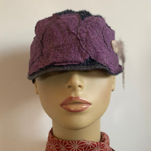 Load image into Gallery viewer, One of a kind design elements and embellishments upcycled from salvaged remnant fabric scraps, and hand sewn in Santa Cruz, CA. 100% cotton cap, handmade in Bali.   Purple drops vibes   Purple blue colored ribbed cap Button and feather embellishments 100% cotton US size 7 1/2&quot; *  Wash cold, hang dry *see size chart for detailed measurement
