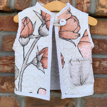 Load image into Gallery viewer, Upcycled from a vintage quilt and cotton tee. Super amazing fabric and salvaged large button. This spirit vest is lightweight and a sweet layer of love!   Handcrafted with love and intention.   Upcycled and one-of-a-kind Button and cord clasp A little pocket for treasures Lightweight Handmade in Santa Cruz, CA Cold wash, hang dry
