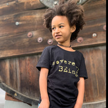 Load image into Gallery viewer, Imagine if we all remembered that we were born as sovereign beings, already in our truest essence from the beginning. The seed in creating this piece was to remember to keep growing and raising our inner child to be who we truly are. Sovereign BEings.  100% cotton, kids tee shirt, hand screen printed with gold metallic ink. Sovereign BEing custom printed logo on the center front.  100% cotton Screen printed by hand in Santa Cruz, CA Limited run

