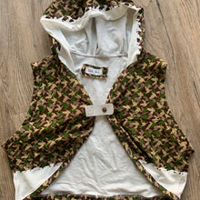 Load image into Gallery viewer, Upcycled, using super limited 4-color sample screen printed dove camo design fabric, salvaged button and super soft scrap leather.   Handcrafted with love and intention.   Handmade in Santa Cruz, CA One-of-a-kind Bolero vest style Cold wash, hang dry. 
