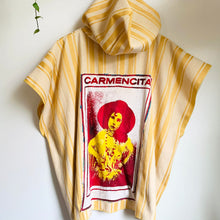 Load image into Gallery viewer, Upcycled from striped cotton blend remnant, super shiny and eclectic salvaged ribbon, and a cotton tee graphic tee. When I received this t-shirt I didn&#39;t know who Carmencita was - turns out she was a Spanish-style notable dancer from the late 1800s/early 1900s. Perhaps this poncho&#39;s story will add a little flavor to your dance vibes?!  Handcrafted with love and intention.  Upcycled poncho Carmencita dancing vibes One-of-a-kind Free size Handmade in Santa Cruz, CA Cold wash, hang dry
