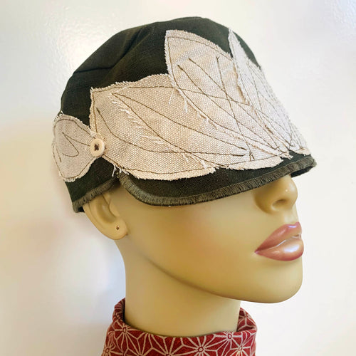 One of a kind design elements and embellishments upcycled from salvaged remnant fabric scraps, and hand sewn in Santa Cruz, CA. 100% cotton cap, handmade in Bali.   Off white 