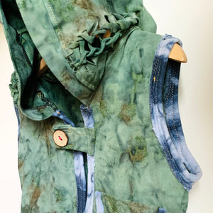 Upcycled from hand dyed cotton leggings from Indonesia, tie dyed organic cotton top and salvaged wooden button. Front pocket and a backpack pocket made for carrying a special lovey or magical treasure (owl not included). Oversized hood, with intricate detail on sides of hood.   Handcrafted with love and intention.   Upcycled and one-of-a-kind Button clasp Size 4-6T Stretchy and a yummy layer of warmth Handmade in Santa Cruz, CA Cold wash