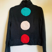 Load image into Gallery viewer, Upcycled a well loved Daisy Fuentes cotton jacket into this super whimsical and vibrant jacket, loaded with fun embellishments, using lots of scrap fabric, salvaged thread, and love. Cord tie in front, super comfortable and a cozy layer of warmth.    Handcrafted with love and intention.   Circles and circles and circles of love One-of-a-kind Wash cold and hang dry Handmade in sunny Santa Cruz, CA
