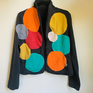 Upcycled a well loved Daisy Fuentes cotton jacket into this super whimsical and vibrant jacket, loaded with fun embellishments, using lots of scrap fabric, salvaged thread, and love. Cord tie in front, super comfortable and a cozy layer of warmth.    Handcrafted with love and intention.   Circles and circles and circles of love One-of-a-kind Wash cold and hang dry Handmade in sunny Santa Cruz, CA