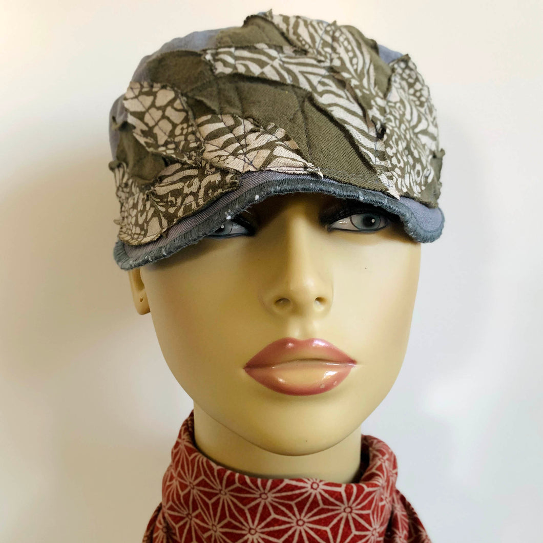 One of a kind design elements and embellishments upcycled from salvaged remnant fabric scraps, and hand sewn in Santa Cruz, CA. 100% cotton cap, handmade in Bali.   Green and white tribal print elements  Slate blue linen cap One-of-a-kind Jungle vibes US size 7 1/4