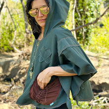 Load image into Gallery viewer, Upcycled from green cotton canvas remnant scraps, and stretch bamboo cotton flare pants. Lightweight and flowy, with oversized hoodie. Bright orange and brown stitching revealed for vibrant vibes, as well as to ensure the edges don&#39;t fray too much! Perfectly imperfect, intentional raw edges. Two large pockets, set perfect for your beautiful hands and found treasures. This piece is the perfect lightweight layer of warmth and earth vibes.   Handcrafted with love and intention.

