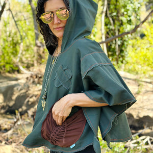 Upcycled from green cotton canvas remnant scraps, and stretch bamboo cotton flare pants. Lightweight and flowy, with oversized hoodie. Bright orange and brown stitching revealed for vibrant vibes, as well as to ensure the edges don't fray too much! Perfectly imperfect, intentional raw edges. Two large pockets, set perfect for your beautiful hands and found treasures. This piece is the perfect lightweight layer of warmth and earth vibes.   Handcrafted with love and intention.
