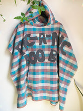 Load image into Gallery viewer, Upcycled from a tablecloth remnant and cotton t-shirt. Olk Skool Yogi Bear vibes. Wanna go on a pic-a-nic boo boo?  Handcrafted with love and intention.  Upcycled poncho One-of-a-kind Hooded poncho ALL SIZE Handmade in Santa Cruz, CA
