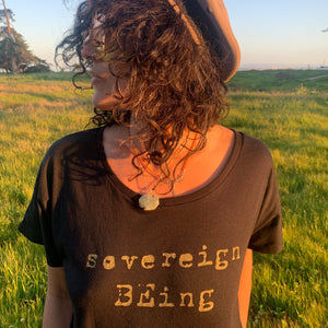 Imagine if we all remembered that we were born as sovereign beings, already in our truest essence from the beginning. The seed in creating this piece was to remember to keep growing and raising our inner child to be who we truly are. Sovereign BEings.  100% ringspun cotton, dolman cut ladies tee shirt, hand screen printed with gold metallic ink in Santa Cruz, CA. Sovereign BEing custom printed logo on the center front.