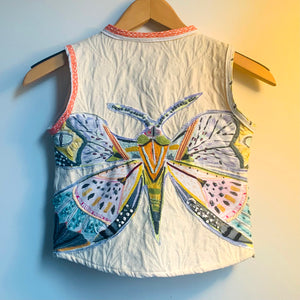 Upcycled from a cotton blend blazer jacket and Lulie Wallace pillowcase, now this delicious and whimsical vest for that perfect extra layer of warmth.   Handcrafted with love and intention.   Upcycled and one-of-a-kind Button clasp Light and whimsical layer of love Handmade in Santa Cruz, CA Size 3-4T Butterfly vibes Cold wash, hang dry
