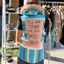 Load image into Gallery viewer, Upcycled from a salvaged adult hoodie, scrap faux fur, other cotton scraps, and a hand screen printed graphic by Shari Elf.  Handcrafted with love and intention.   Heavily sprinkled with lots of detail and embellishments Conscious message: &quot;All good things are wild and free&quot; Handmade in Santa Cruz, CA Zipper and button clasps Size adult M/L long fit Cold wash, hang dry
