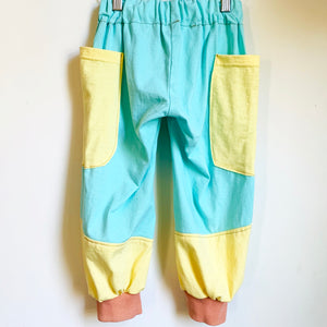 Upcycled from a couple of cotton t-shirts, and cuffs from a cotton hoodie. Big pockets for treasures and lots of room to move and flow.    Handcrafted with love and intention.  One-of-a-kind Size 2-3T Side pockets for accent and special treasures Handmade in Santa Cruz, CA Cold wash