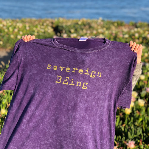 Imagine if we all remembered that we were born as sovereign beings, already in our truest essence from the beginning. The inspiration for this piece is to remember to keep growing and raising our inner child to BE who we truly are. Sovereign BEings.  100% cotton, mens adult tee shirt, hand screen printed with gold metallic ink on mineral purple wash. Sovereign BEing custom hand printed logo on the center front.